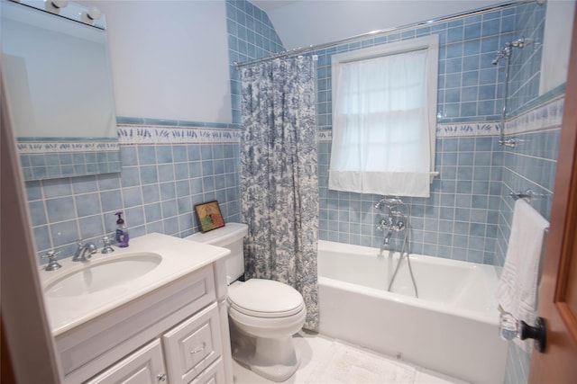 full bath with tile walls, shower / bath combination with curtain, toilet, and vanity