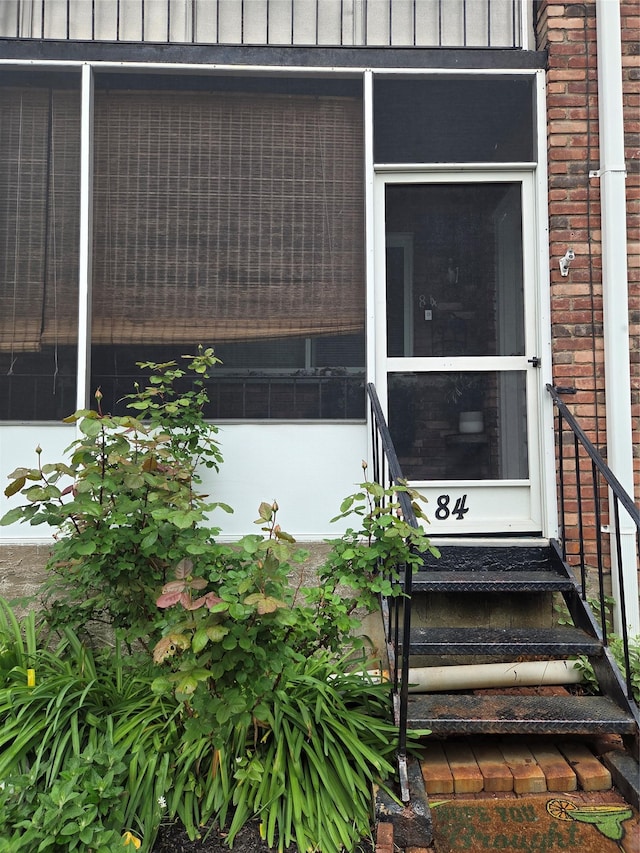 810 Blooming Grove Tpke Unit 84, New Windsor, NY 12553 - view of exterior entry featuring brick siding and board and batten siding
