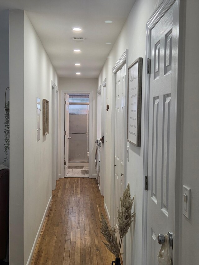 810 Blooming Grove Tpke Unit 84, New Windsor, NY 12553 - corridor with dark wood finished floors, baseboards, and washer / clothes dryer