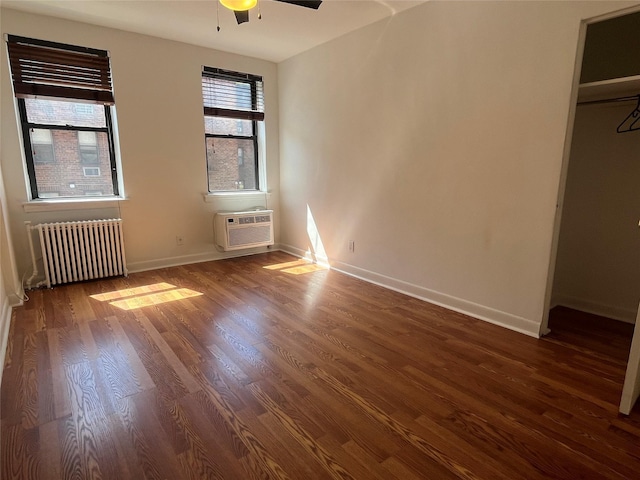 215-44 47th Ave Unit 2B, Bayside, NY 11361 - unfurnished bedroom with radiator heating unit, wood finished floors, baseboards, and a ceiling fan
