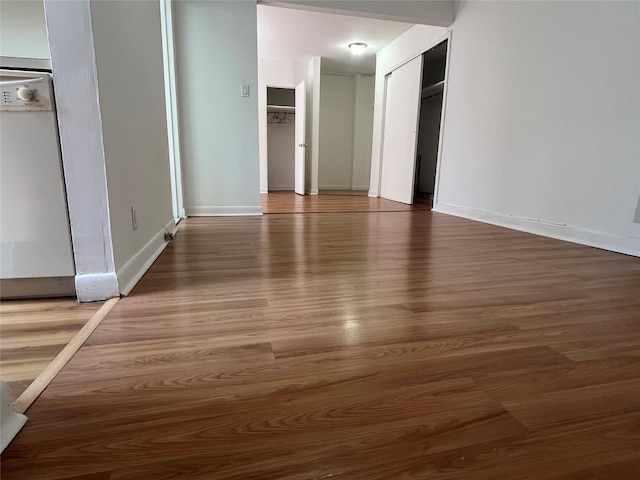 215-44 47th Ave Unit 2B, Bayside, NY 11361 - spare room with wood finished floors and baseboards
