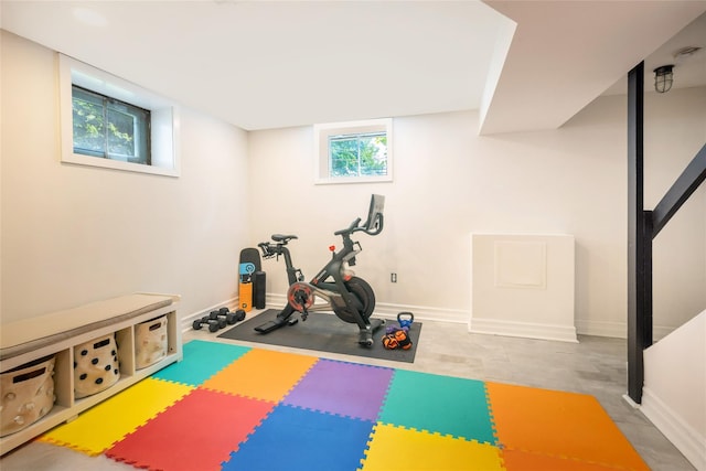 workout area featuring baseboards