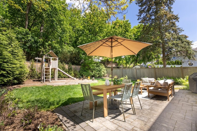 view of patio / terrace with outdoor lounge area, a playground, and outdoor dining space