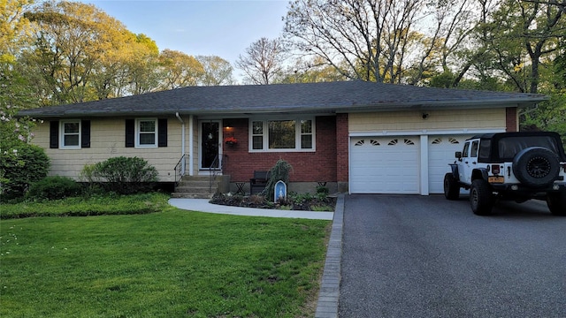 ranch-style house with an attached garage, a front yard, driveway, a shingled roof, and entry steps