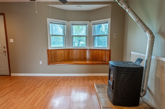 231 Stone Bridge Road Ext, Durham, NY 12423 - additional living space with a wood stove, light wood-style floors, and ceiling fan