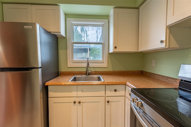 231 Stone Bridge Road Ext, Durham, NY 12423 - kitchen with stainless steel appliances, a sink, and white cabinets