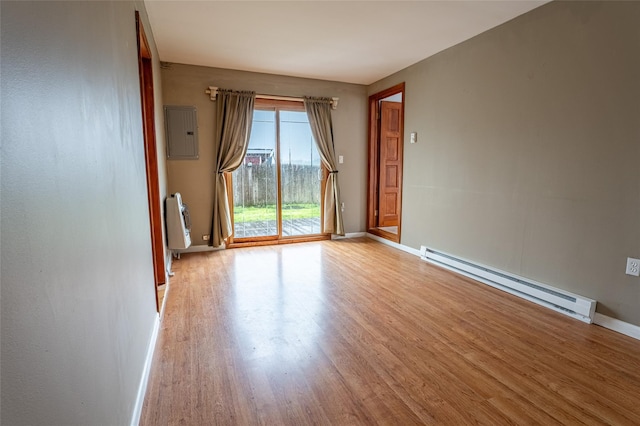 231 Stone Bridge Road Ext, Durham, NY 12423 - unfurnished room with a baseboard radiator, light wood-style flooring, baseboards, electric panel, and heating unit