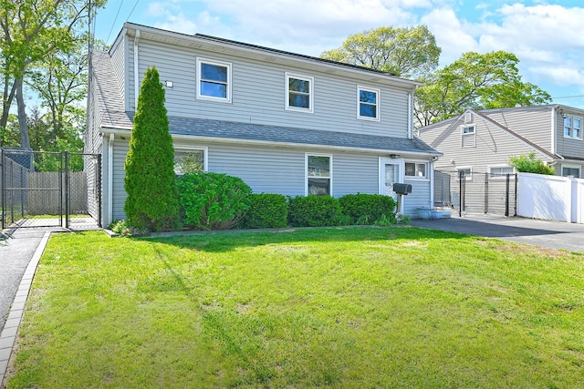 63 William St, Copiague, NY 11726 - view of front of property featuring a gate