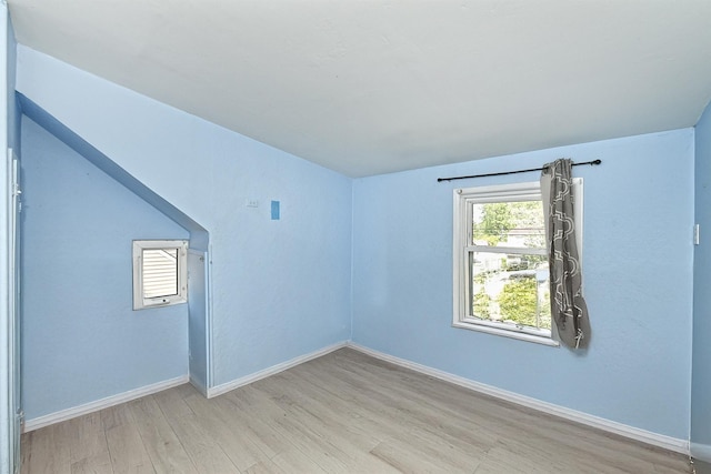 63 William St, Copiague, NY 11726 - empty room featuring wood finished floors and baseboards