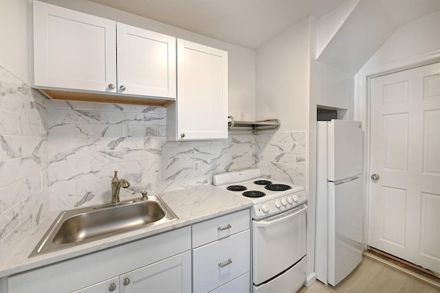 63 William St, Copiague, NY 11726 - kitchen with white appliances, a sink, white cabinetry, and backsplash