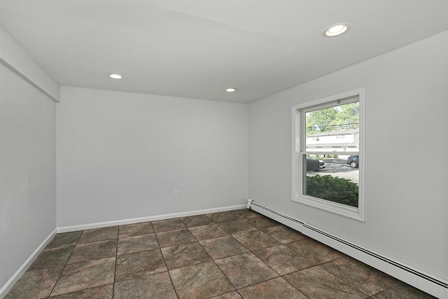 63 William St, Copiague, NY 11726 - empty room with a baseboard radiator, baseboards, recessed lighting, and dark stone finish floors