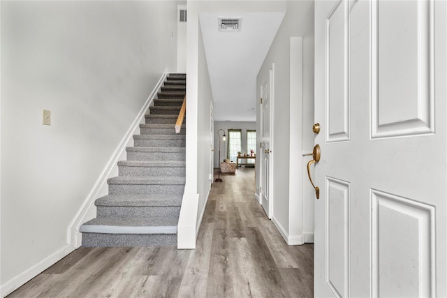 37 Spruce St, Pawling, NY 12564 - foyer entrance featuring stairs, wood finished floors, and baseboards