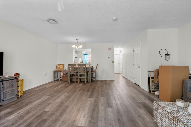 37 Spruce St, Pawling, NY 12564 - living area with wood finished floors, a chandelier, baseboards, and a textured ceiling