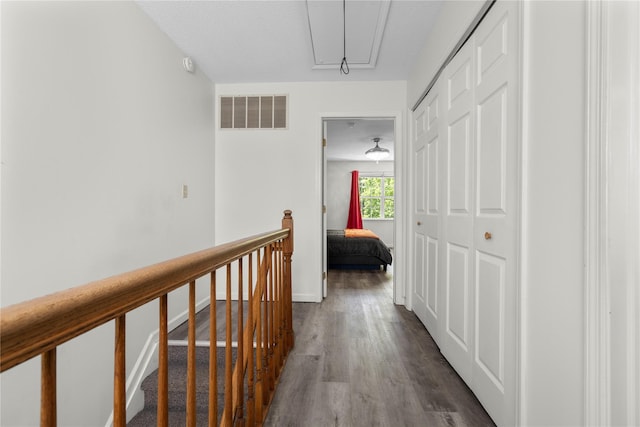 37 Spruce St, Pawling, NY 12564 - hallway with attic access, dark wood finished floors, and an upstairs landing