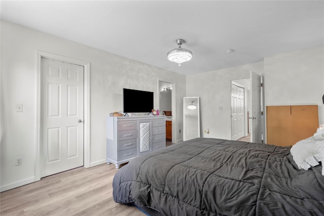 37 Spruce St, Pawling, NY 12564 - bedroom featuring light wood-type flooring, baseboards, and connected bathroom