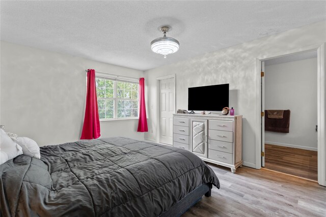 37 Spruce St, Pawling, NY 12564 - bedroom with a textured ceiling, wood finished floors, and baseboards