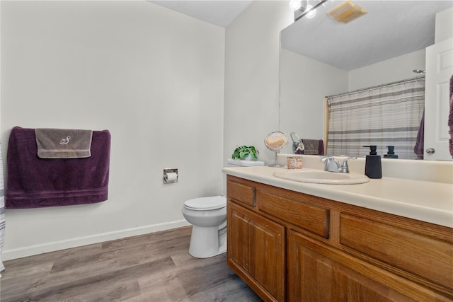 37 Spruce St, Pawling, NY 12564 - full bathroom featuring toilet, vanity, wood finished floors, baseboards, and curtained shower