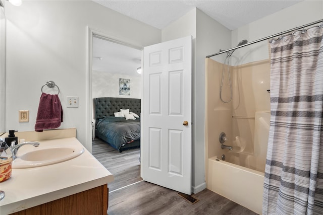 37 Spruce St, Pawling, NY 12564 - ensuite bathroom featuring wood finished floors, shower / bath combo, and vanity