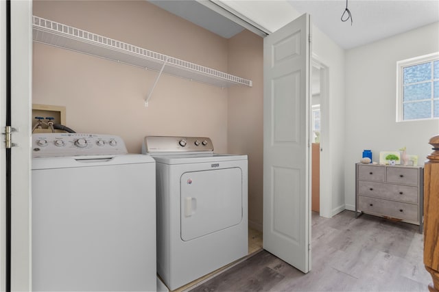 37 Spruce St, Pawling, NY 12564 - laundry room featuring washing machine and clothes dryer, light wood-type flooring, and baseboards