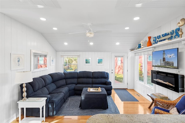 67 N Rd Unit A, Hampton Bays, NY 11946 - living room with wood finished floors, recessed lighting, vaulted ceiling, a fireplace, and ceiling fan