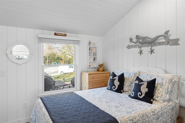 67 N Rd Unit A, Hampton Bays, NY 11946 - bedroom with a decorative wall and lofted ceiling
