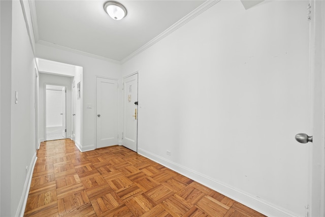 empty room with baseboards and ornamental molding