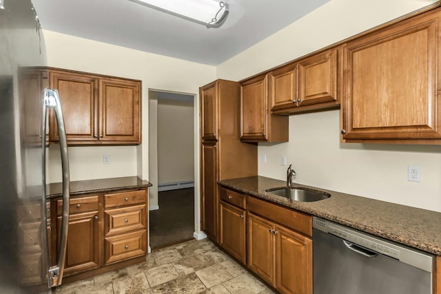 14 Florence Unit 25D, Freeport, NY 11520 - kitchen featuring appliances with stainless steel finishes, a sink, a baseboard heating unit, and brown cabinetry