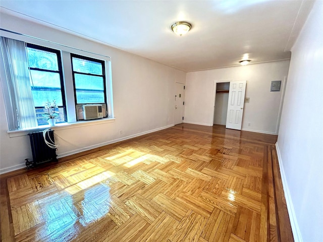 62-64 Saunders St Unit 3H, Rego Park, NY 11374 - unfurnished room featuring cooling unit and baseboards