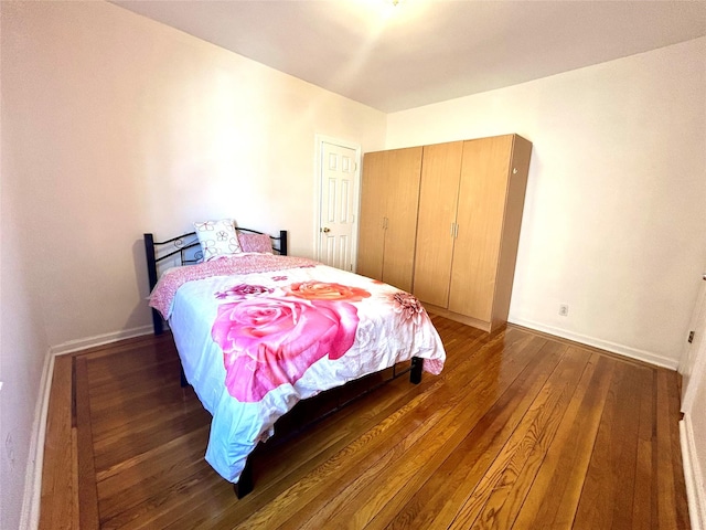 62-64 Saunders St Unit 3H, Rego Park, NY 11374 - bedroom featuring wood finished floors and baseboards