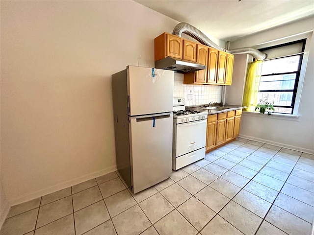 62-64 Saunders St Unit 3H, Rego Park, NY 11374 - kitchen with white appliances, under cabinet range hood, light tile patterned floors, backsplash, and baseboards