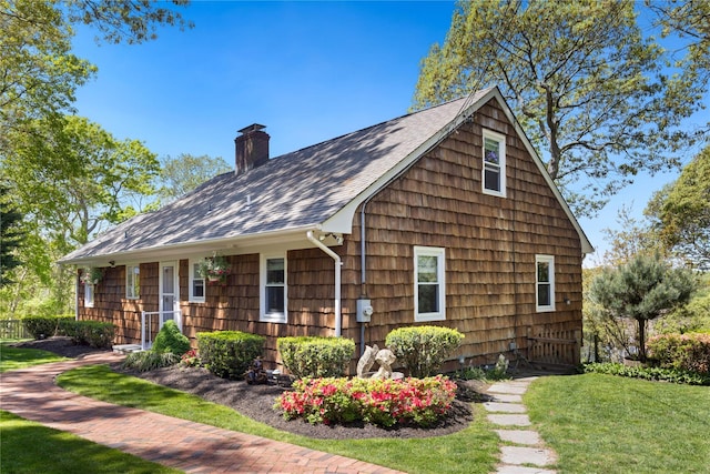 3 Summit Dr, Baiting Hollow, NY 11933 - view of front facade with a chimney, a front yard, and a shingled roof