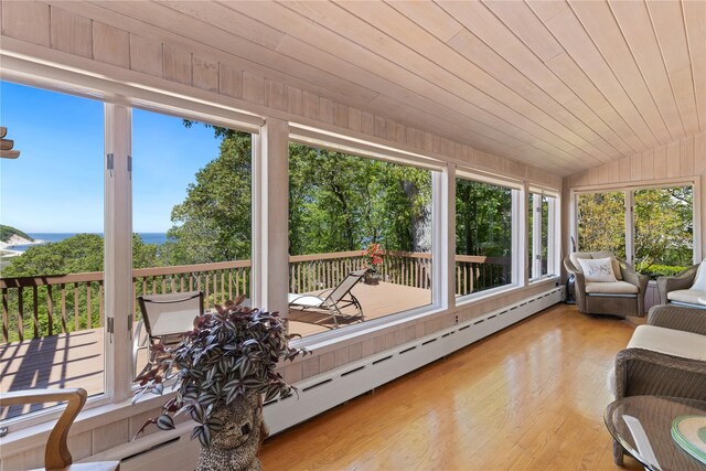 3 Summit Dr, Baiting Hollow, NY 11933 - sunroom / solarium with baseboard heating, a deck with water view, wood finished floors, and lofted ceiling