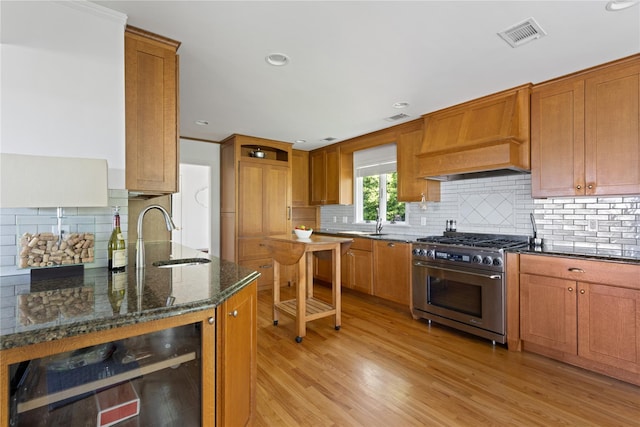 3 Summit Dr, Baiting Hollow, NY 11933 - kitchen featuring high end range, a sink, premium range hood, tasteful backsplash, and recessed lighting