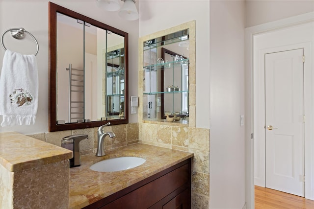 3 Summit Dr, Baiting Hollow, NY 11933 - bathroom featuring vanity, wood finished floors, and tasteful backsplash