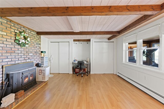 3 Summit Dr, Baiting Hollow, NY 11933 - living area featuring a baseboard heating unit, beamed ceiling, light wood finished floors, a wood stove, and an office area