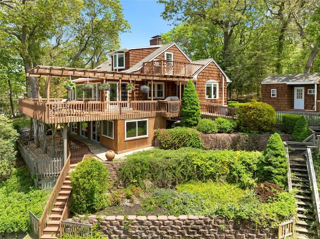3 Summit Dr, Baiting Hollow, NY 11933 - rear view of property featuring stairway, a chimney, a deck, and an outbuilding