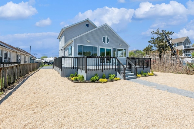 view of front of home featuring fence