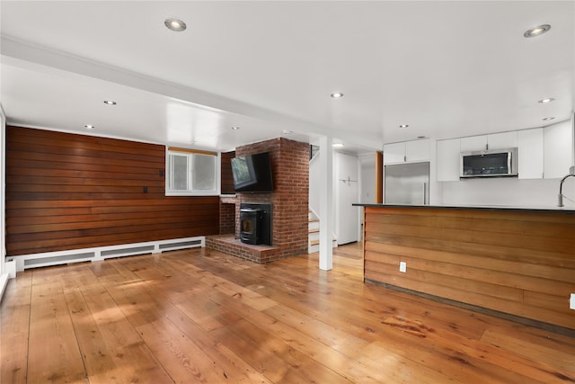 14 Lounsbury Rd, Croton-On-Hudson, NY 10520 - unfurnished living room with light wood-style floors and recessed lighting