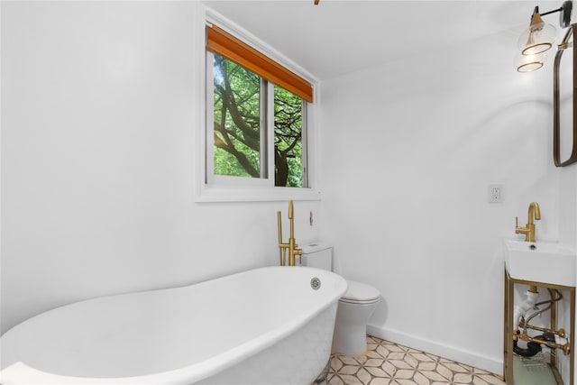 14 Lounsbury Rd, Croton-On-Hudson, NY 10520 - bathroom with a soaking tub, a sink, and baseboards