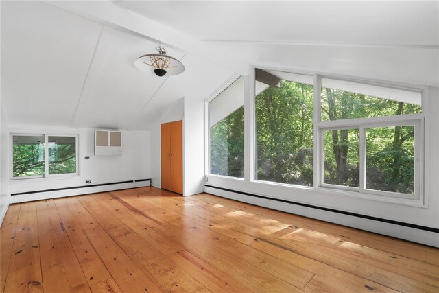 14 Lounsbury Rd, Croton-On-Hudson, NY 10520 - unfurnished living room with baseboard heating, a wall mounted air conditioner, and wood-type flooring