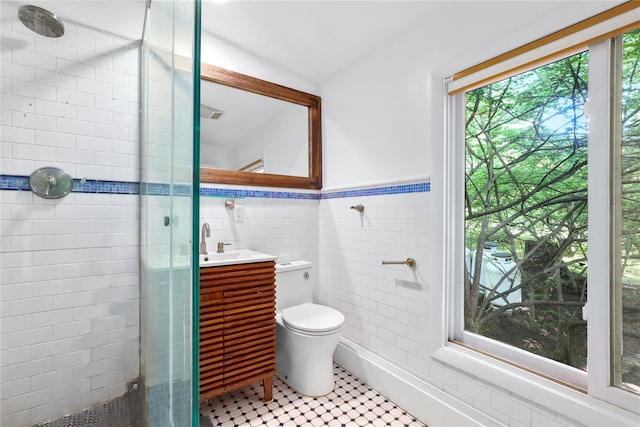 14 Lounsbury Rd, Croton-On-Hudson, NY 10520 - bathroom featuring tile walls, a shower stall, vanity, toilet, and tile patterned floors