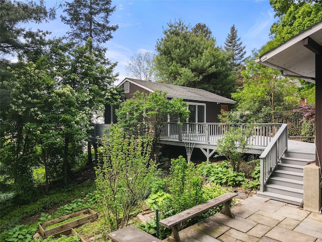 14 Lounsbury Rd, Croton-On-Hudson, NY 10520 - back of property with a deck and a garden