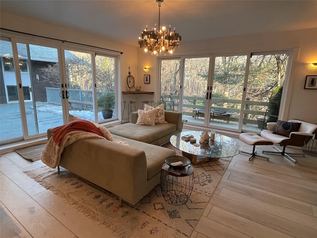 14 Lounsbury Rd, Croton-On-Hudson, NY 10520 - living area featuring french doors, wood-type flooring, and a chandelier