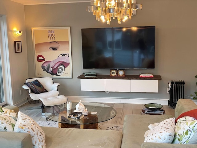 14 Lounsbury Rd, Croton-On-Hudson, NY 10520 - living area with a chandelier, baseboards, wood finished floors, and radiator heating unit