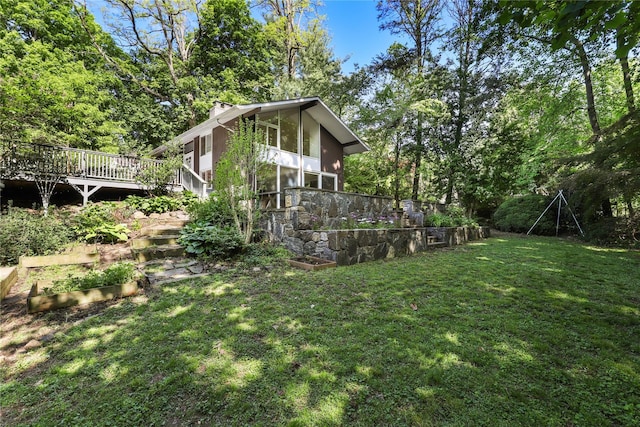 14 Lounsbury Rd, Croton-On-Hudson, NY 10520 - view of green lawn with a wooden deck and a sunroom