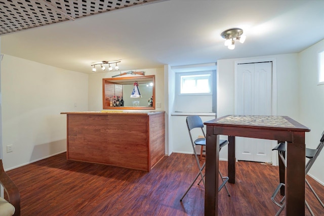 19 Croyden St, New Hyde Park, NY 11040 - dining area featuring dark wood finished floors, a dry bar, and baseboards