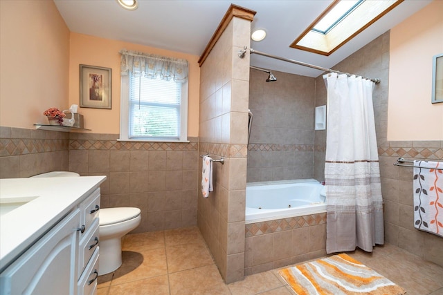 19 Croyden St, New Hyde Park, NY 11040 - full bath with tile walls, a skylight, tile patterned floors, wainscoting, and toilet