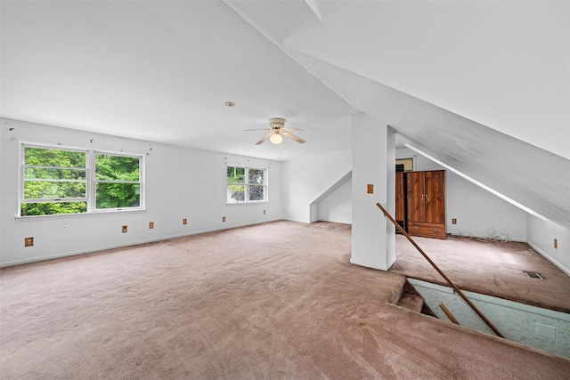 bonus room featuring carpet floors, a ceiling fan, and lofted ceiling