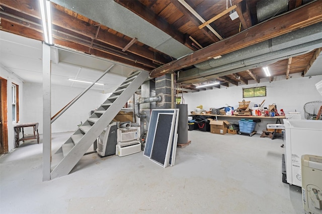 basement with stairs and water heater