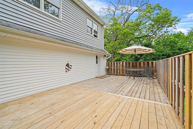 wooden deck with outdoor dining area